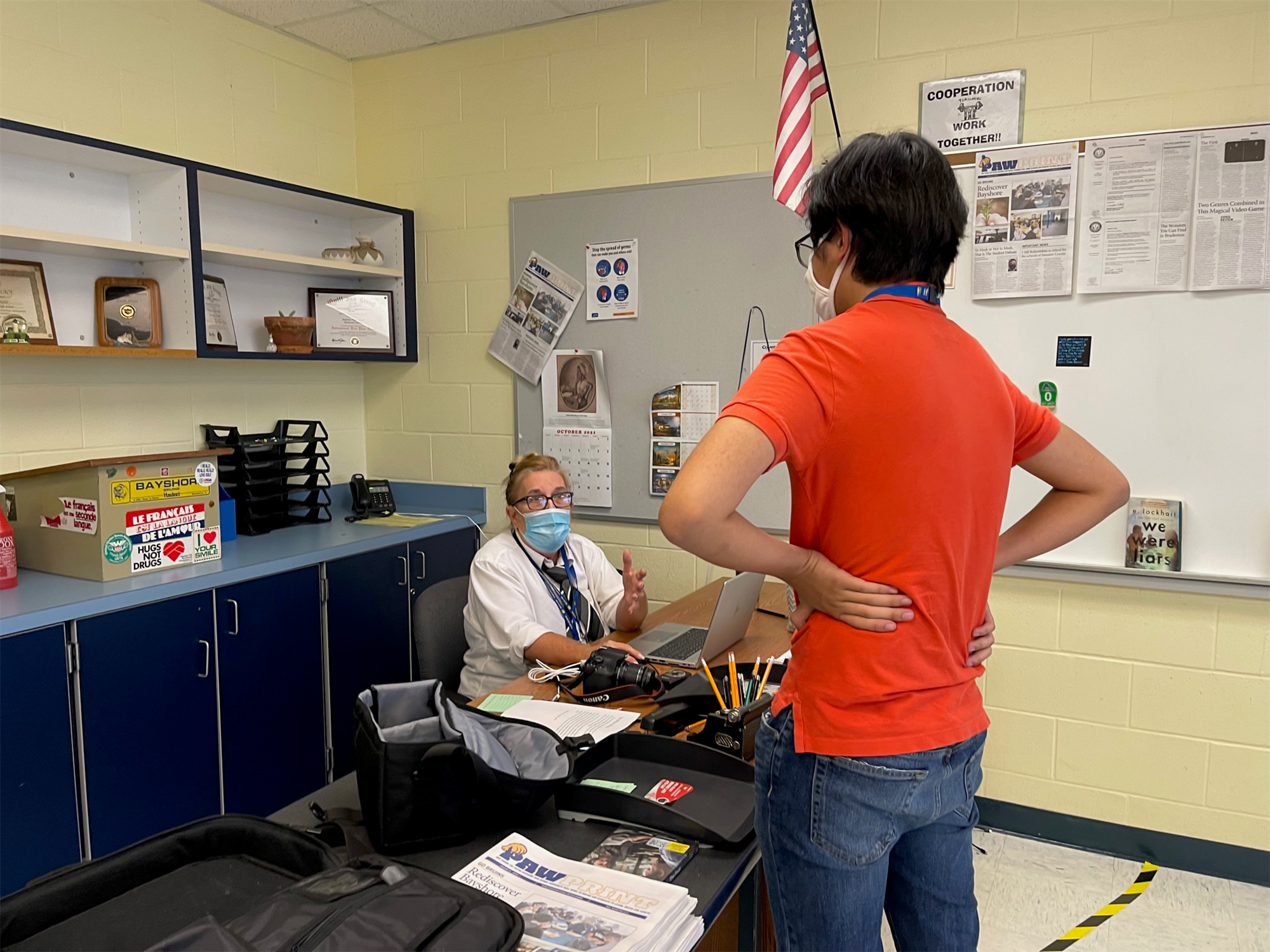 A Bayshore High journalism student speaking to Teacher Jean Faulk